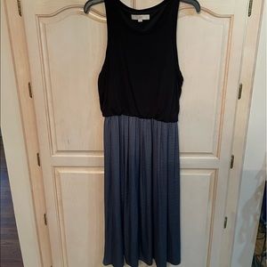 A LOFT Midi in size M. The black top blouses over the flowing smoke blue bottom!
